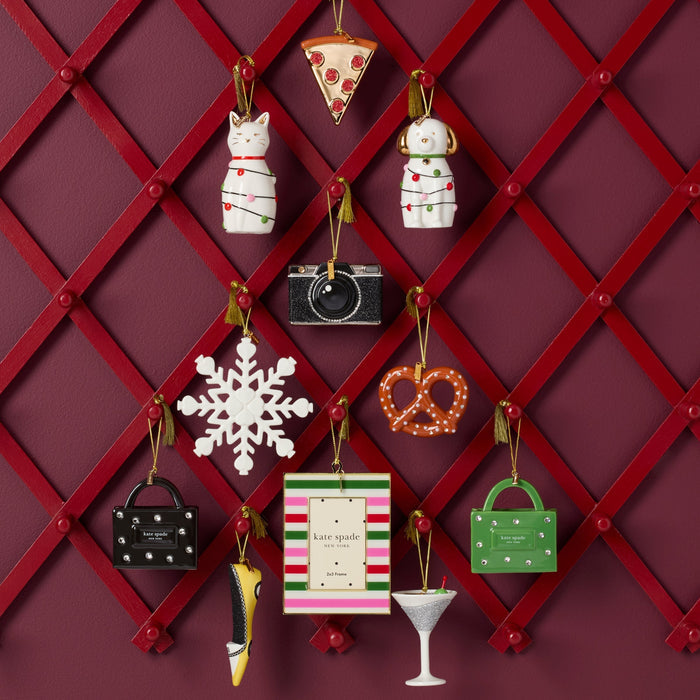 Decorative Christmas ornaments on a red lattice background
