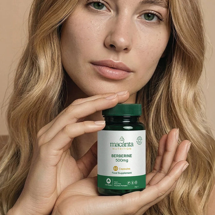 Woman holding a bottle of macaana Berberine 500mg supplement